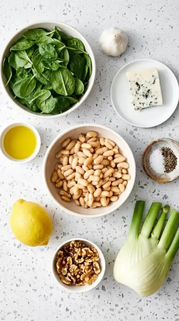 Warm Spinach and White Bean Salad Recipe : Easy & Vibrant 6 Warm Spinach and White Bean Salad ingredients with spinach, beans, fennel, walnuts, lemon, and cheese