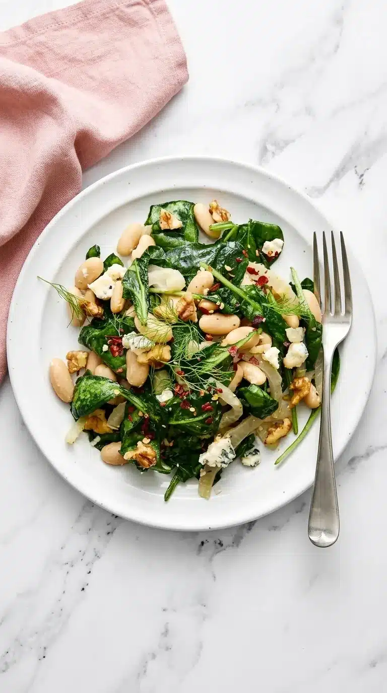 Warm Spinach and White Bean Salad with fennel, Gorgonzola, walnuts, and red pepper flakes