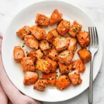 Air Fryer Salmon Bites Recipe : Amazing Quick Weeknight Feast 11 Air Fryer Salmon Bites with juicy centers, golden edges, lemon garlic butter, and fresh herbs