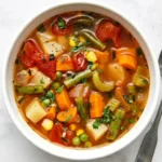 Easy Vegetable Soup Recipe : Simple, Happy Comfort 11 Easy Vegetable Soup with carrots, potatoes, green beans, tomatoes, corn, peas, and fresh parsley