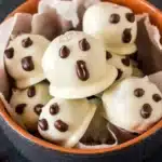 Ghost Oreo Balls Recipe : 5 Easy, Scary Halloween Treats 9 Ghost Oreo Balls with white candy coating and chocolate ghost faces for Halloween
