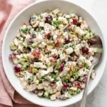 Healthy Chicken Salad with grapes, celery, toasted almonds, and fresh herbs in creamy dressing