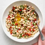 Healthy Marinated White Beans with roasted peppers, fresh herbs, lemon, and olive oil