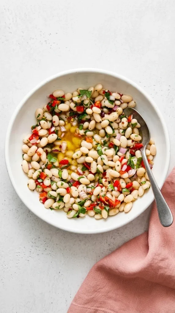 Healthy Marinated White Beans with roasted peppers, fresh herbs, lemon, and olive oil