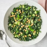 Kale chickpea salad with lemon tahini dressing, cucumber, feta, mint, and dill