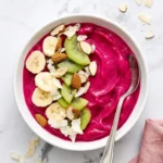 Pitaya Smoothie Bowl: Thick and Creamy 5-Minute Breakfast 7 Pitaya smoothie bowl with banana, kiwi, almonds, and coconut flakes
