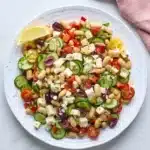 White Bean Salad With Feta with tomatoes, cucumber, olives, herbs and lemon dressing