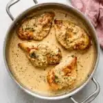 Chicken Dijon with golden chicken breasts in creamy mustard sauce, shallots, and fresh thyme