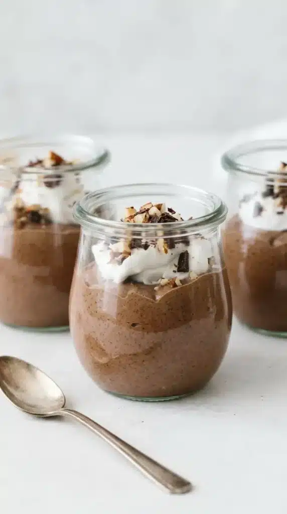 Chocolate Chia Pudding Mousse Recipe : Easy Rich Dessert 6 Chocolate Chia Pudding Mousse in glass jars with whipped cream, pecans, and chocolate