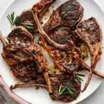 Garlic Rosemary Grilled Lamb Chops – Tender, Juicy, and Full of Flavor 7 Garlic Rosemary Grilled Lamb Chops with golden seared crust, fresh rosemary, and juicy grilled meat on a ceramic plate