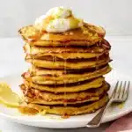 Lemon Ricotta Protein Pancakes with maple syrup, whipped yogurt, and fresh lemon zest