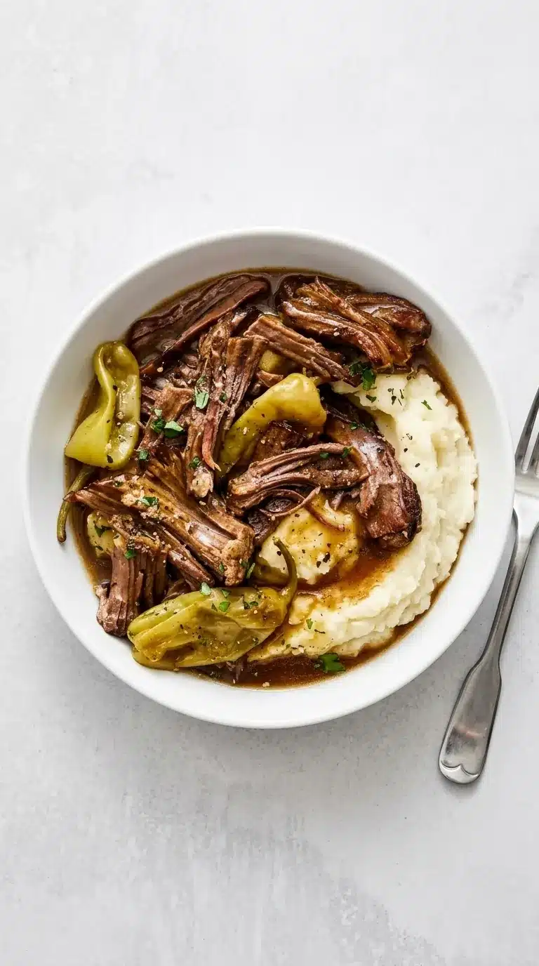 home 6 Slow Cooker Mississippi Pot Roast with tender beef, pepperoncini, gravy, and mashed potatoes