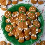 Soft & Chewy Gingerbread Men Cookies with royal icing and festive sprinkles on a Christmas serving platter