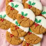 White Chocolate Dipped Ginger Cookies: Christmas Magic 7 White Chocolate Dipped Ginger Cookies with green holly icing and red berries on a rustic holiday background
