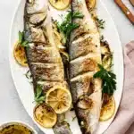 Whole Roasted Branzino (Lemon Herb) Recipe : Amazing Dinner 7 Whole roasted branzino with lemon and herbs on an oval platter